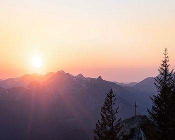 Scenic view of snowcapped mountains against sky during sunset