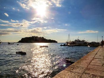 Scenic view of boat in sea against sky