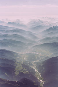 Aerial view of mountains against sky during sunset