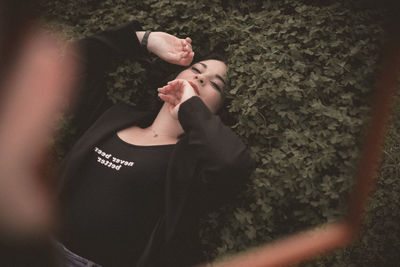 High angle view of woman resting on floor