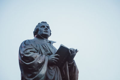 Low angle view of statue against clear sky