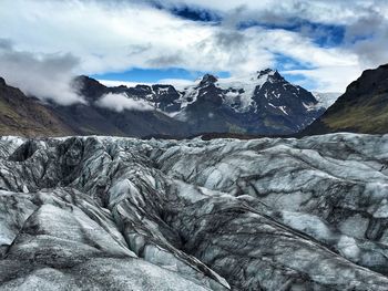 Scenic view of snowcapped mountains against sky