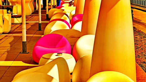 Low section of shoes on multi colored chairs