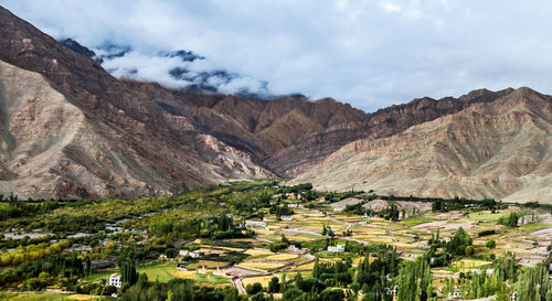 Scenic view of landscape and mountains against sky