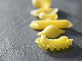 Close-up of various pastas on slate