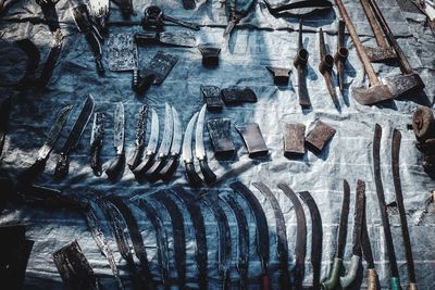 Full frame shot of knives on table