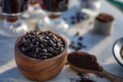 Still life with coffee beans, wooden spoon, coffee pot, scoop, making coffee at home