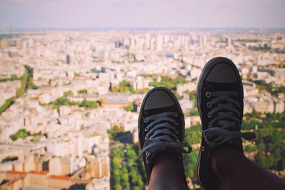 Low section of man standing on cityscape