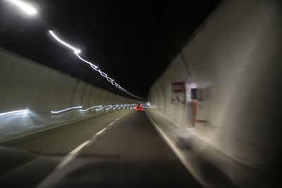 View of illuminated tunnel at night