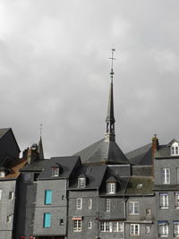 Low angle view of buildings in city against sky