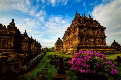 Statue of temple against cloudy sky