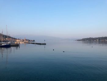 Scenic view of sea against clear blue sky