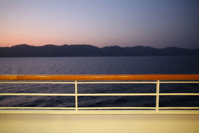 Scenic view of sea against clear sky during sunset