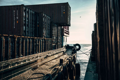 Panoramic shot of old buildings by sea against sky