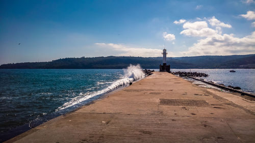 Surface level of pier over calm blue sea