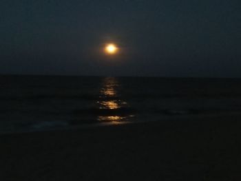 Scenic view of sea against sky at night