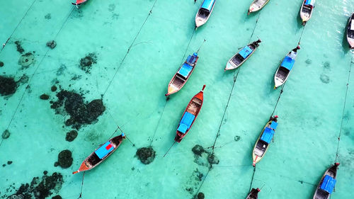 High angle view of boats moored at harbor