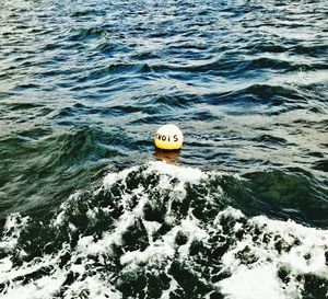 High angle view of boat floating on sea