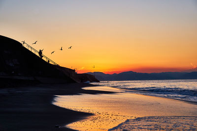 Scenic view of sea against sky during sunset