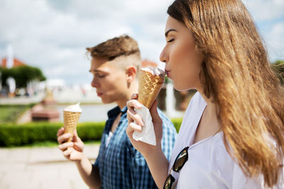 Young woman holding ice cream