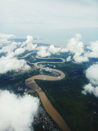 Aerial view of landscape against clouds