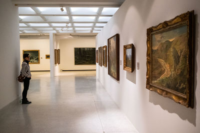 Woman standing in front of museum