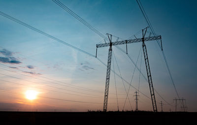 Power lines on the sky background in evening