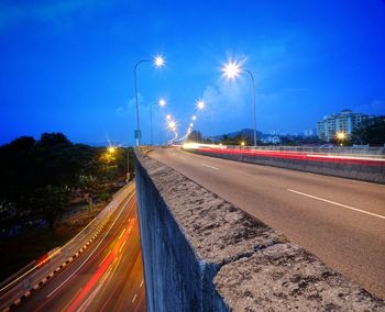 Light trails on road in city at night