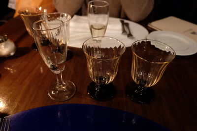 Close-up of wine glasses on table