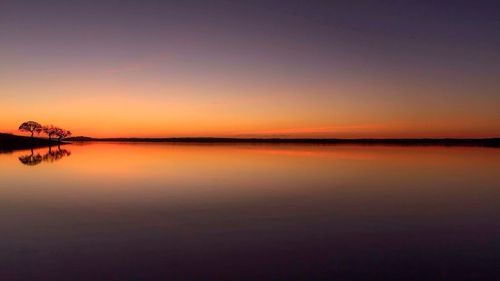 Scenic view of sea at sunset