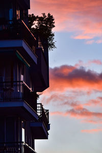 Low angle view of silhouette building against sky during sunset