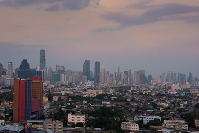 Cityscape against sky during sunset