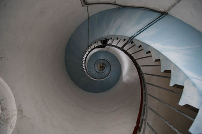 Directly below shot of spiral staircase in building