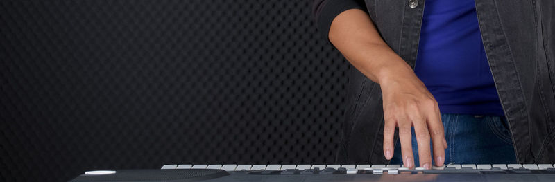 Midsection of man standing at home