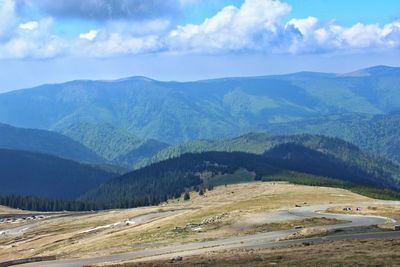 Scenic view of landscape and mountains against sky