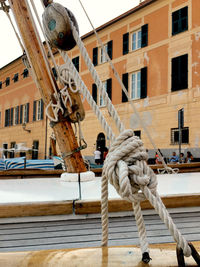 Low angle view of rope tied to building