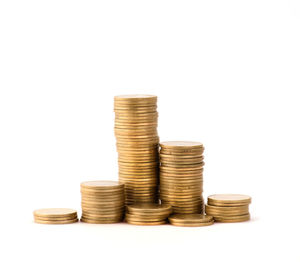 Stack of coins against white background