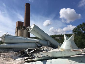 Destroyed factory against sky