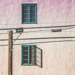 Low angle view of window on wall of building