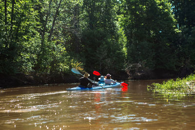 Man kayaking in lake