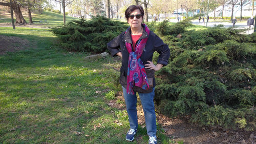 Portrait of young man standing on field