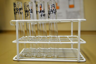 Close-up of test tubes on rack at table