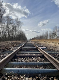 Surface level of railroad tracks against sky