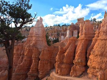 Panoramic view of rock formations against sky