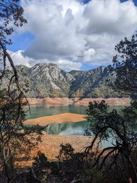 Scenic view of lake against sky. low water levels in shasta, california 