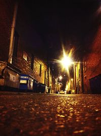 Illuminated street lights in city at night