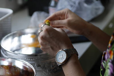 Cropped image of man washing hands