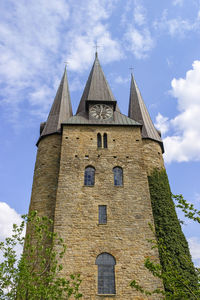 Husaby church tower with climbing plants on the wall
