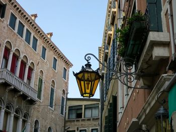 Low angle view of antique lantern in city