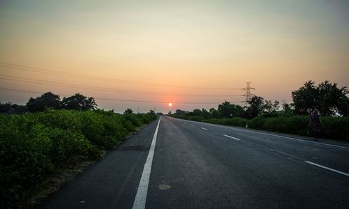 Empty road at sunset